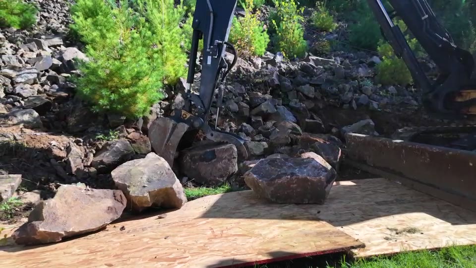 No Plan LLC excavator working with boulders at a recent project